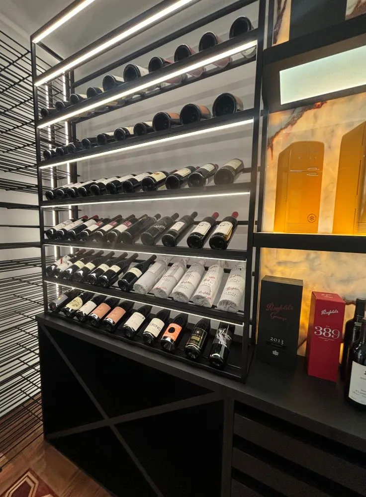 a shelf of wine bottles