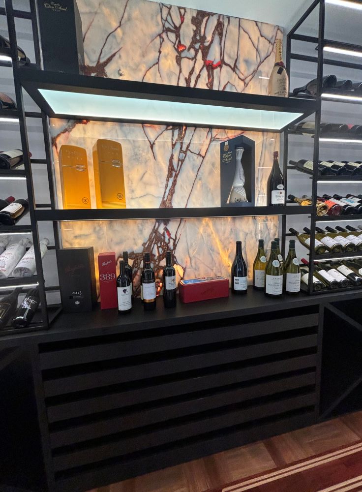 a shelf with bottles of wine on it