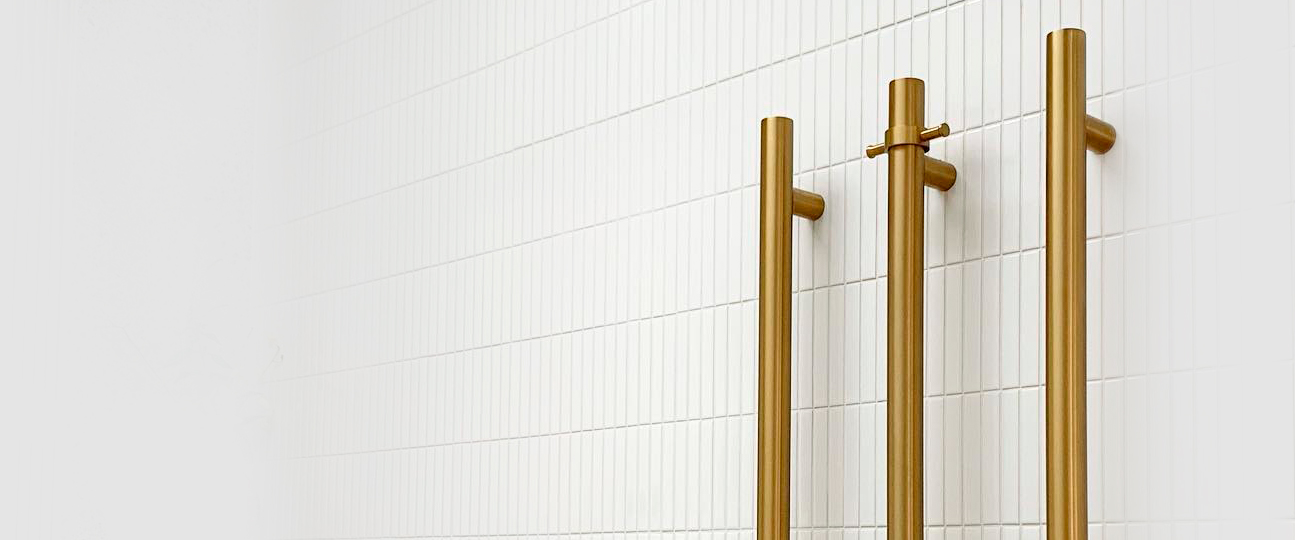 gold vertical heated towel rail - Custom Homes