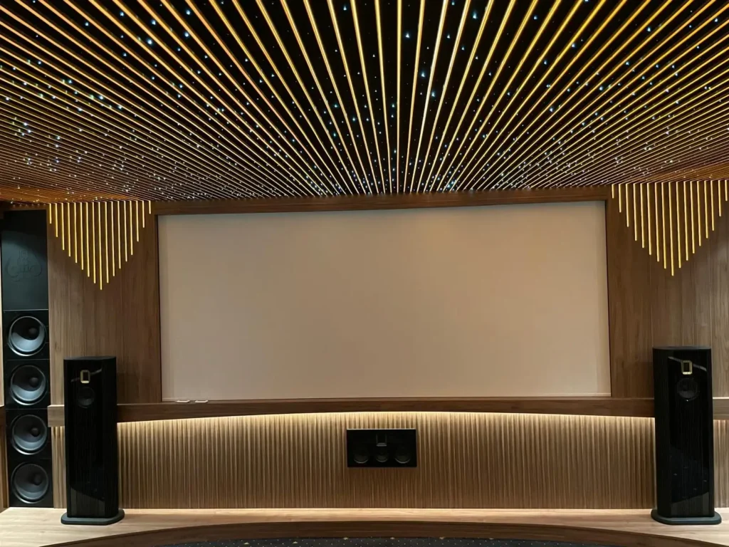 Modern cinema room featuring acoustic wall treatments