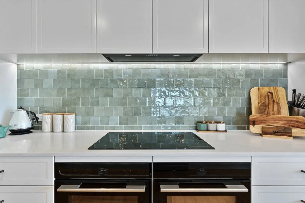 Coastal kitchen design Perth with green fluted island and white shaker cabinetry