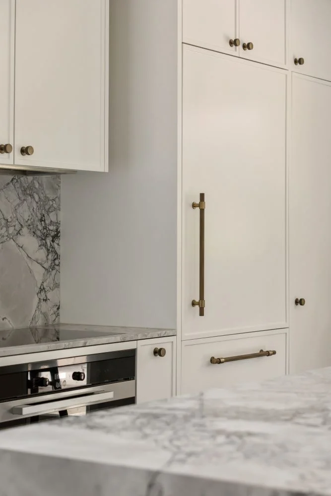 shaker cabinetry with natural stone benchtops