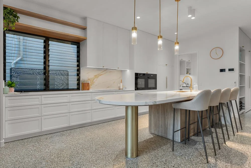 Modern extension contrasting with original Queenslander architecture
