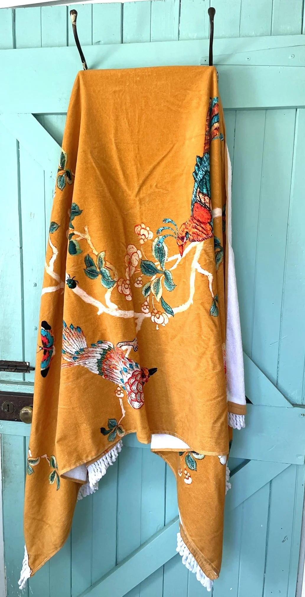 Gold Chinoiserie beach towel with oversized floral and bird pattern