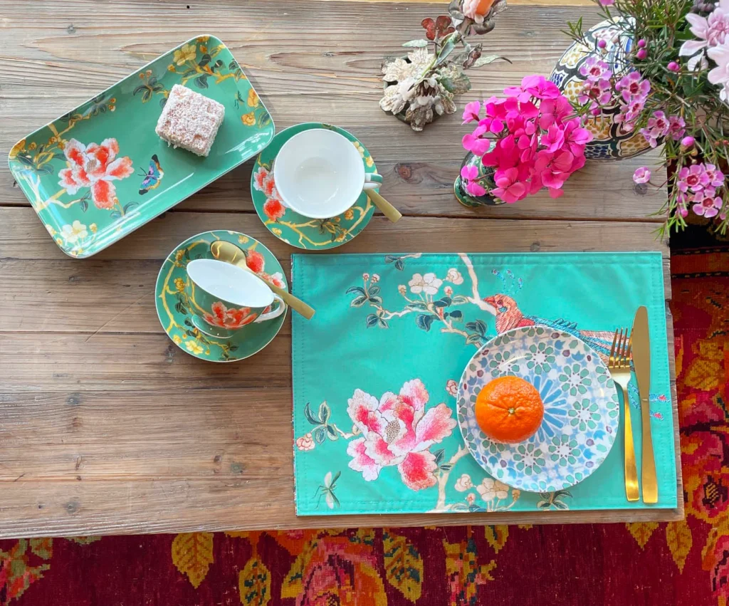 Celadon Chinoiserie teacup and saucer with botanical bird design