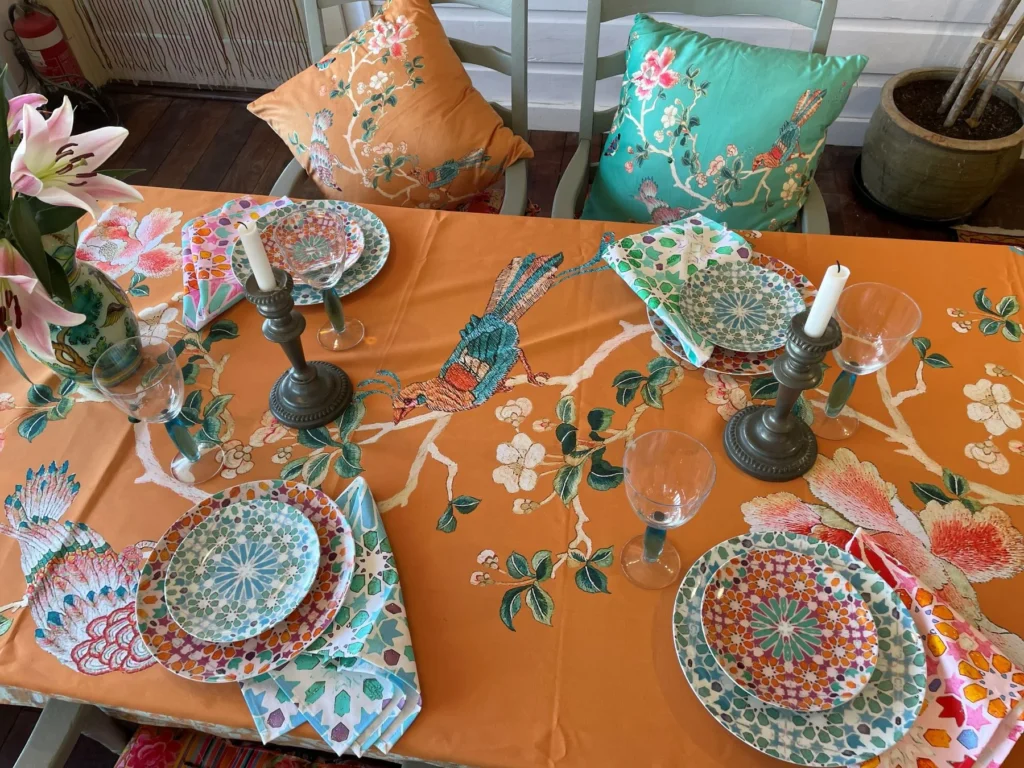 Colourful spring entertaining table setting with Chinoiserie homewares and flowers