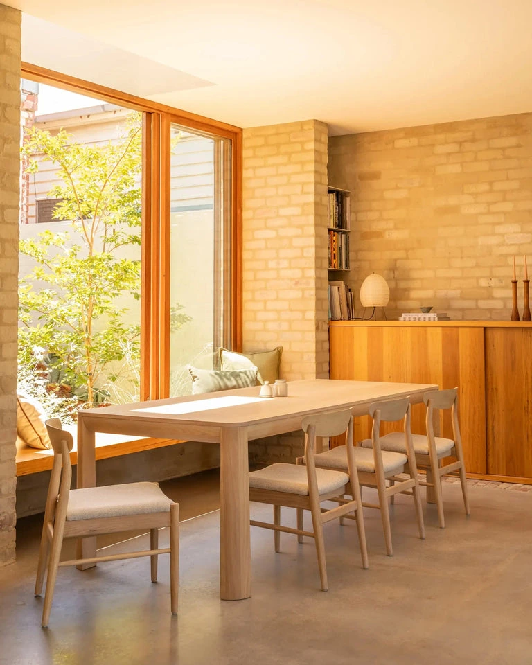 Dark timber dining chair reflecting 2027 furniture trends