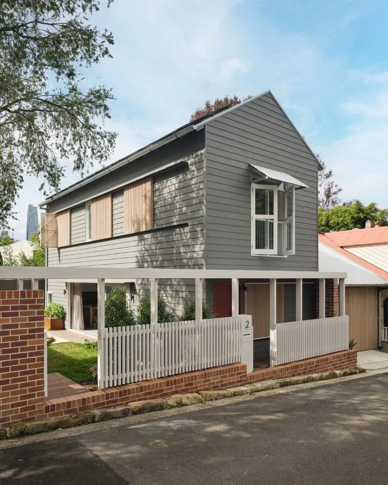 Rear exterior of contemporary Balmain residence with covered pergola
