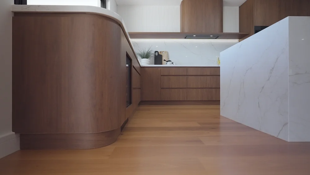 Luxury walnut cabinetry in contemporary City Beach kitchen