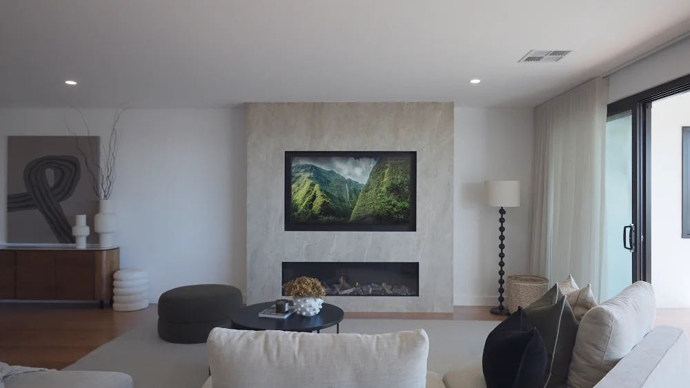 Walnut fireplace cabinetry with stone-look porcelain surround