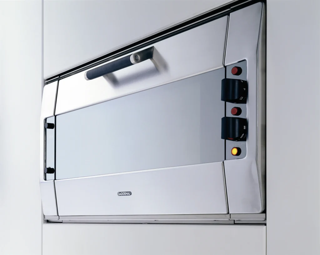 Contemporary luxury kitchen featuring integrated Gaggenau cooking and ventilation appliances.