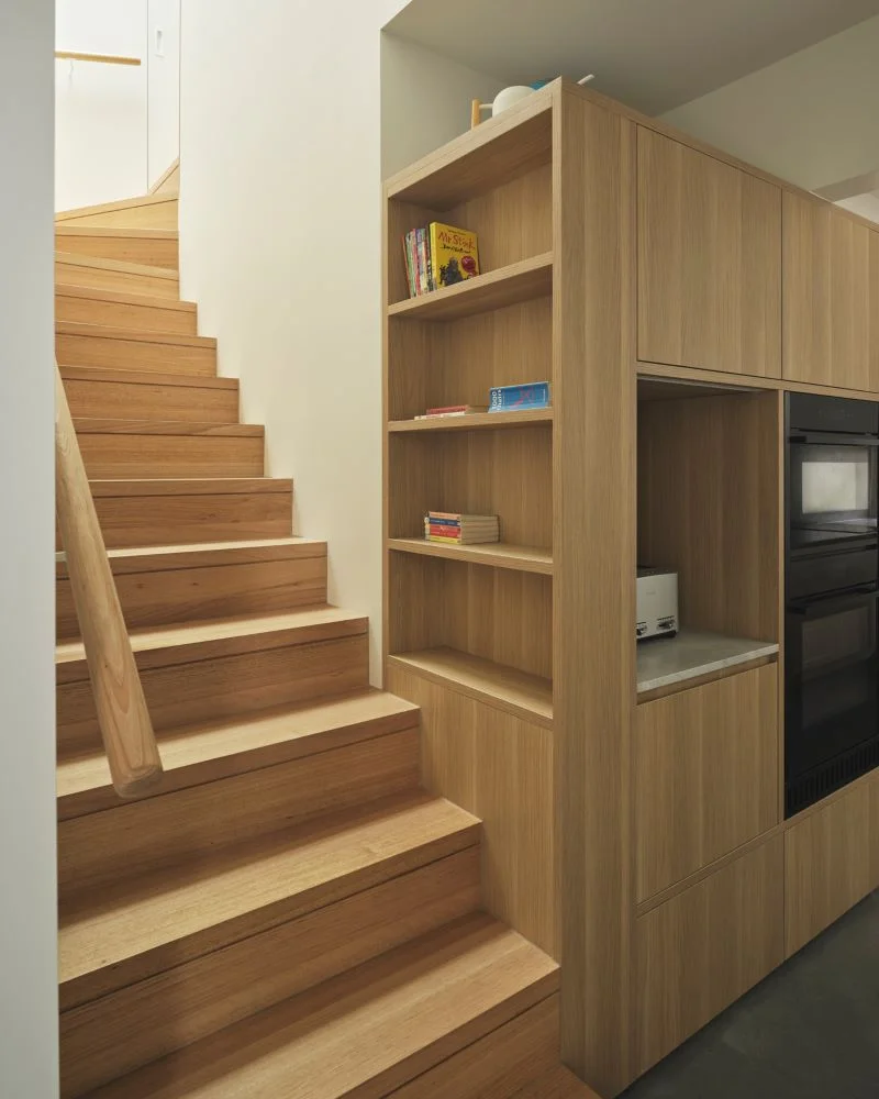 Central stairwell with three skylights bringing natural light into Balmain home