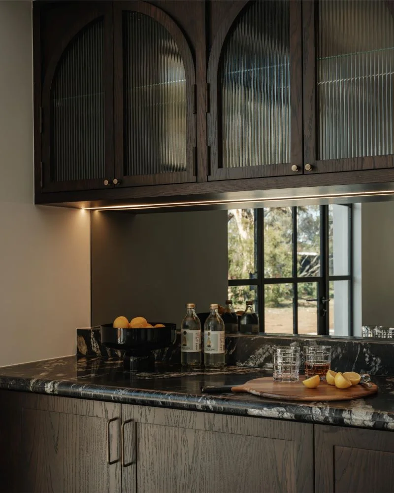 Rich dark interior of Riverbend luxury home in Werribee