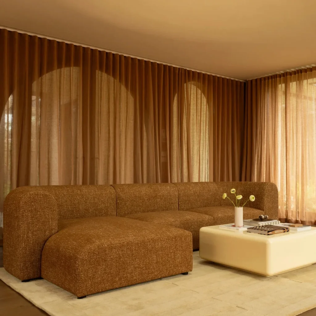 Contemporary interior with dark timber textured upholstery and natural stone